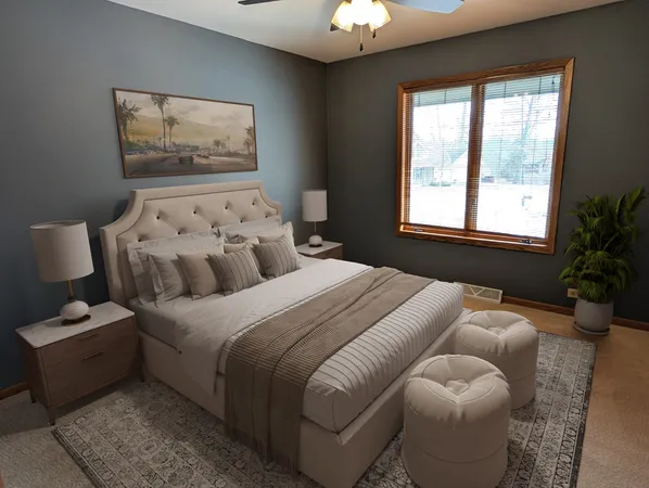 a bedroom with bed and a couch