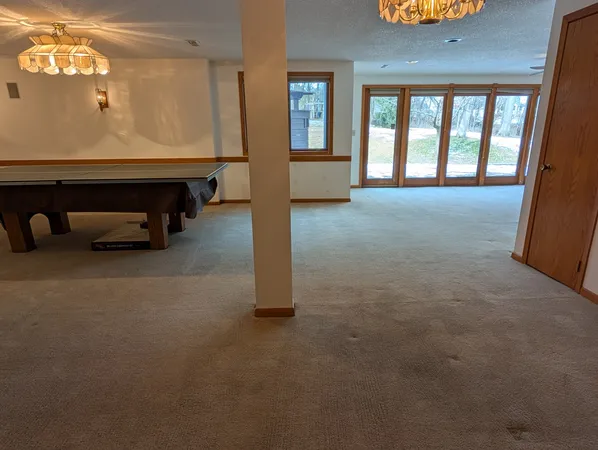 wooden floor with furniture and window