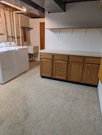 a view of a kitchen with furniture and window