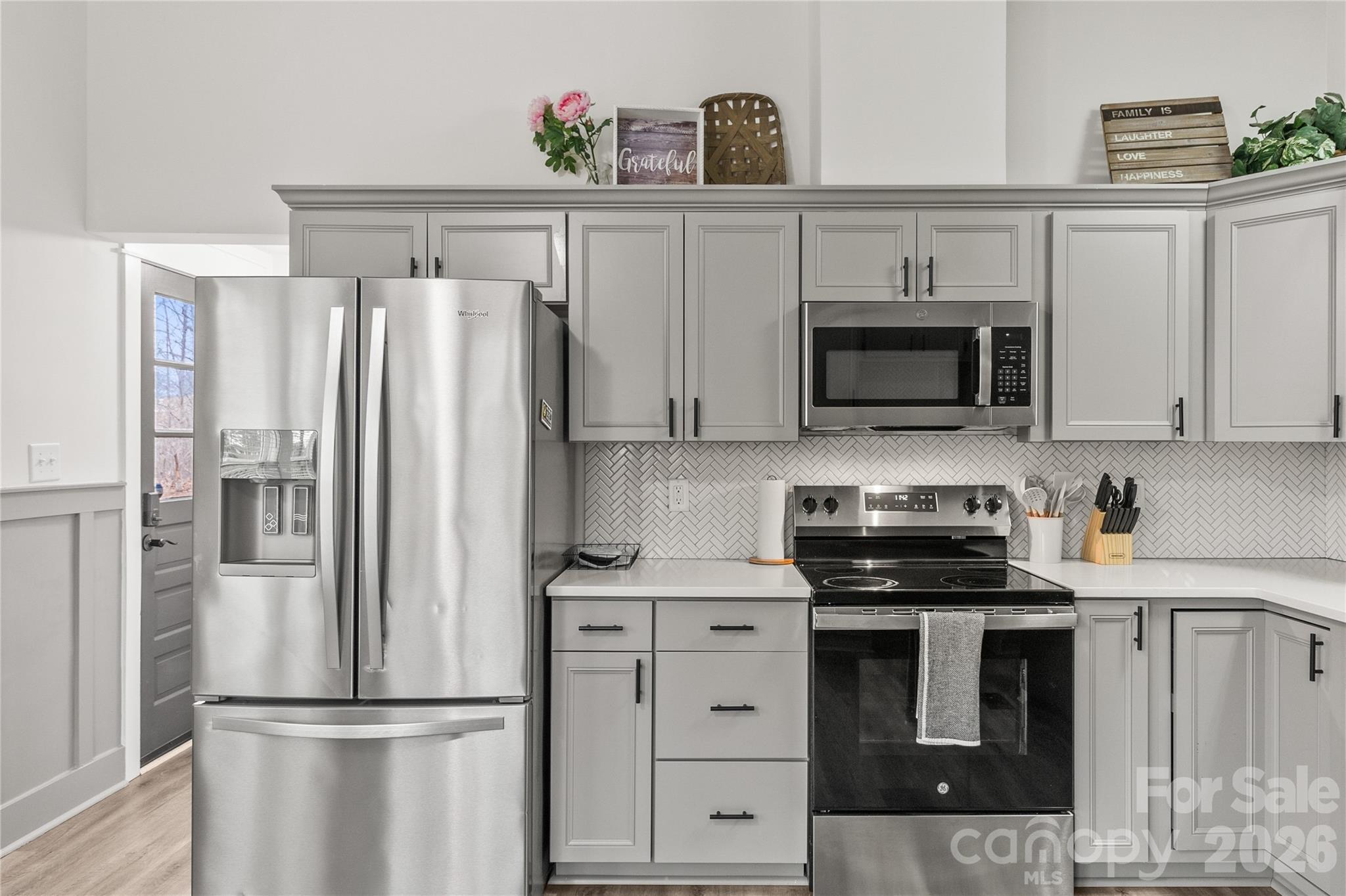 176 Odell School Road Concord, NC 28027 - Photo 15 of 46 a kitchen with stainless steel appliances a refrigerator stove and microwave
