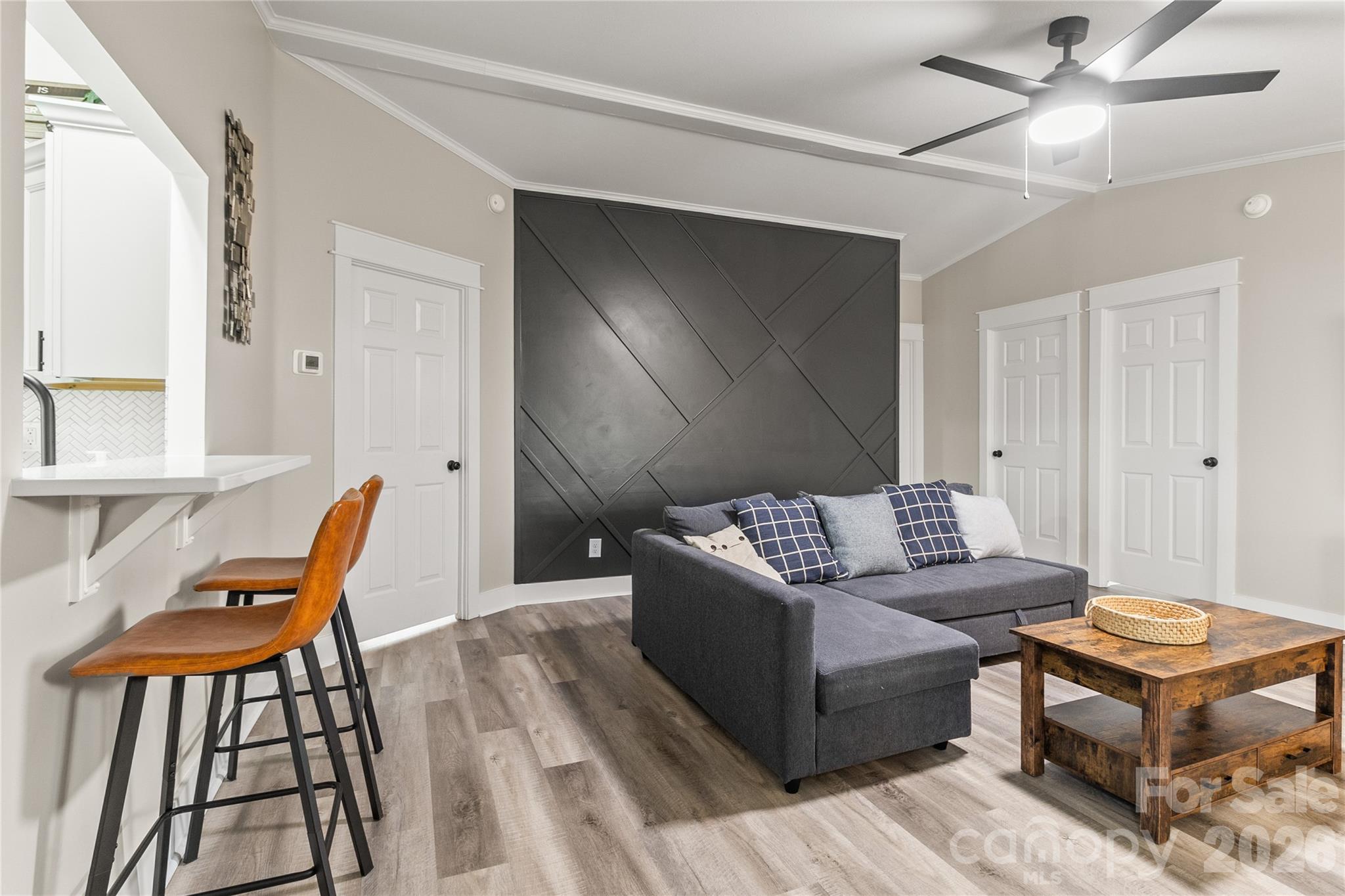 176 Odell School Road Concord, NC 28027 - Photo 20 of 46 a living room with furniture a rug and a chandelier