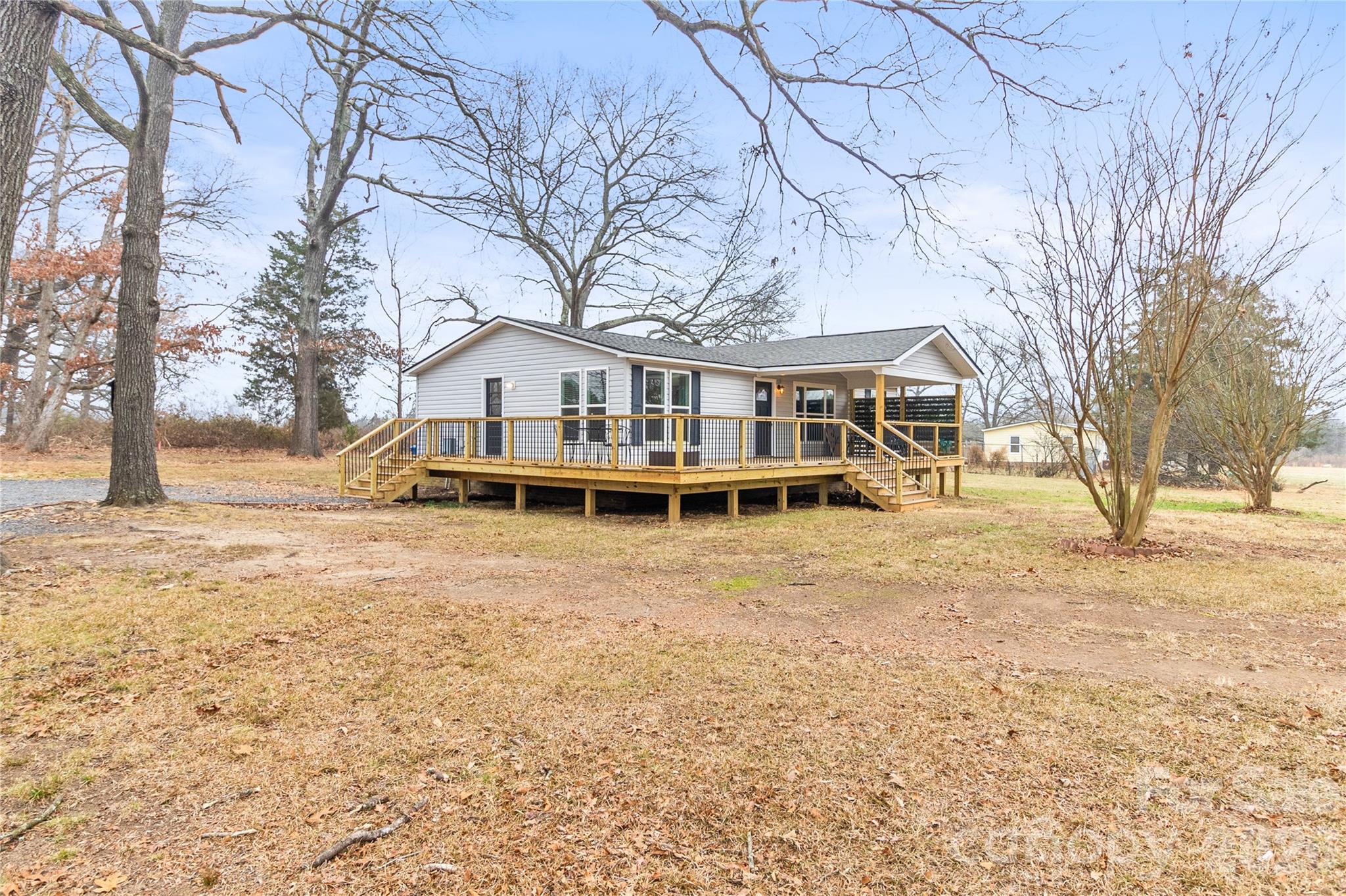 176 Odell School Road Concord, NC 28027 - Photo 2 of 46 a house with trees in front of it