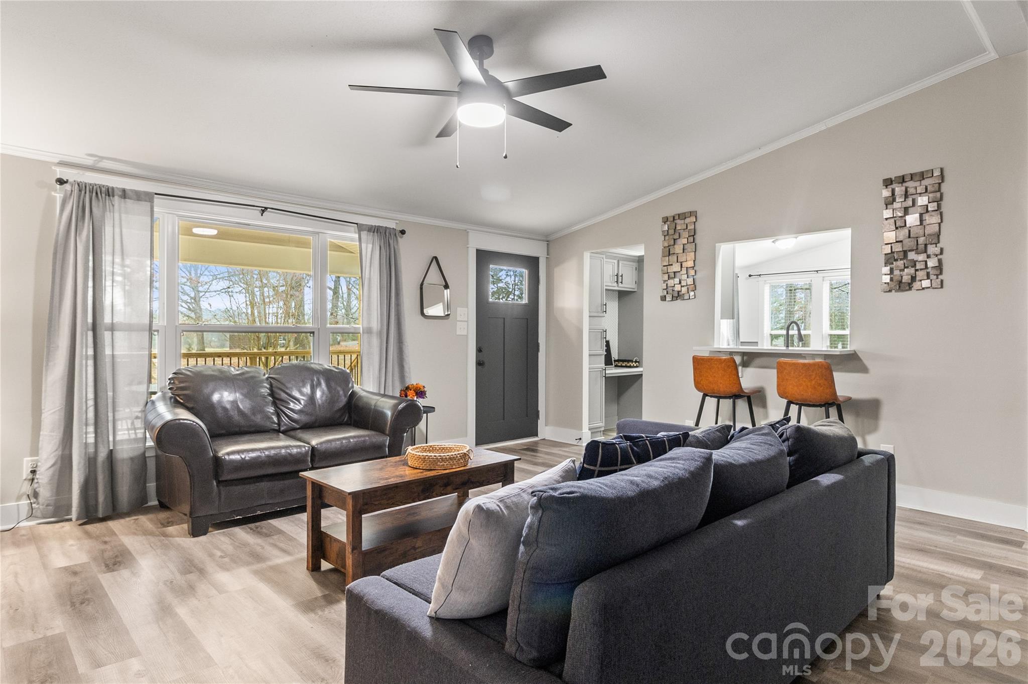 176 Odell School Road Concord, NC 28027 - Photo 21 of 46 a living room with furniture and a large window