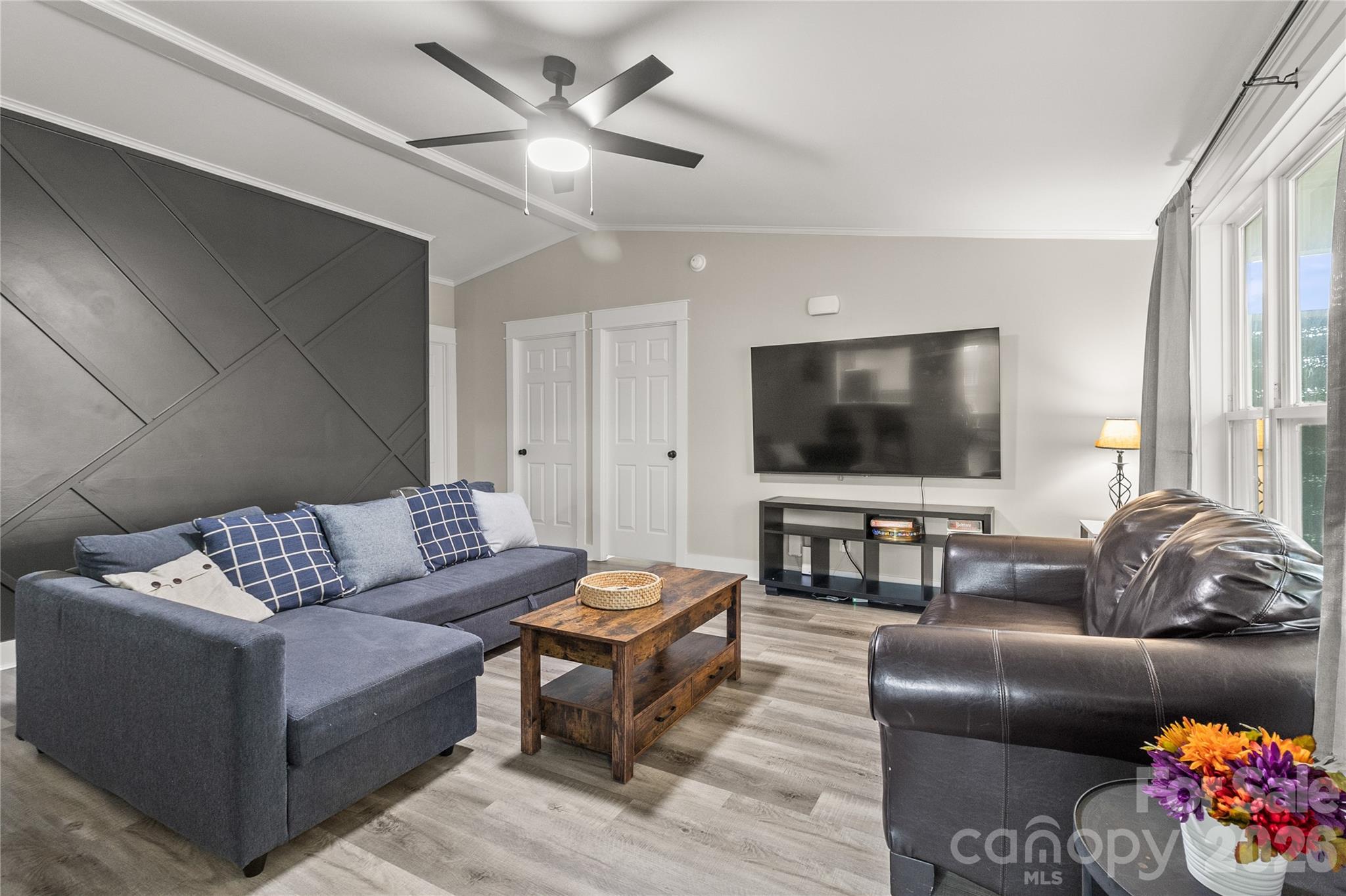 176 Odell School Road Concord, NC 28027 - Photo 23 of 46 a living room with furniture and a flat screen tv