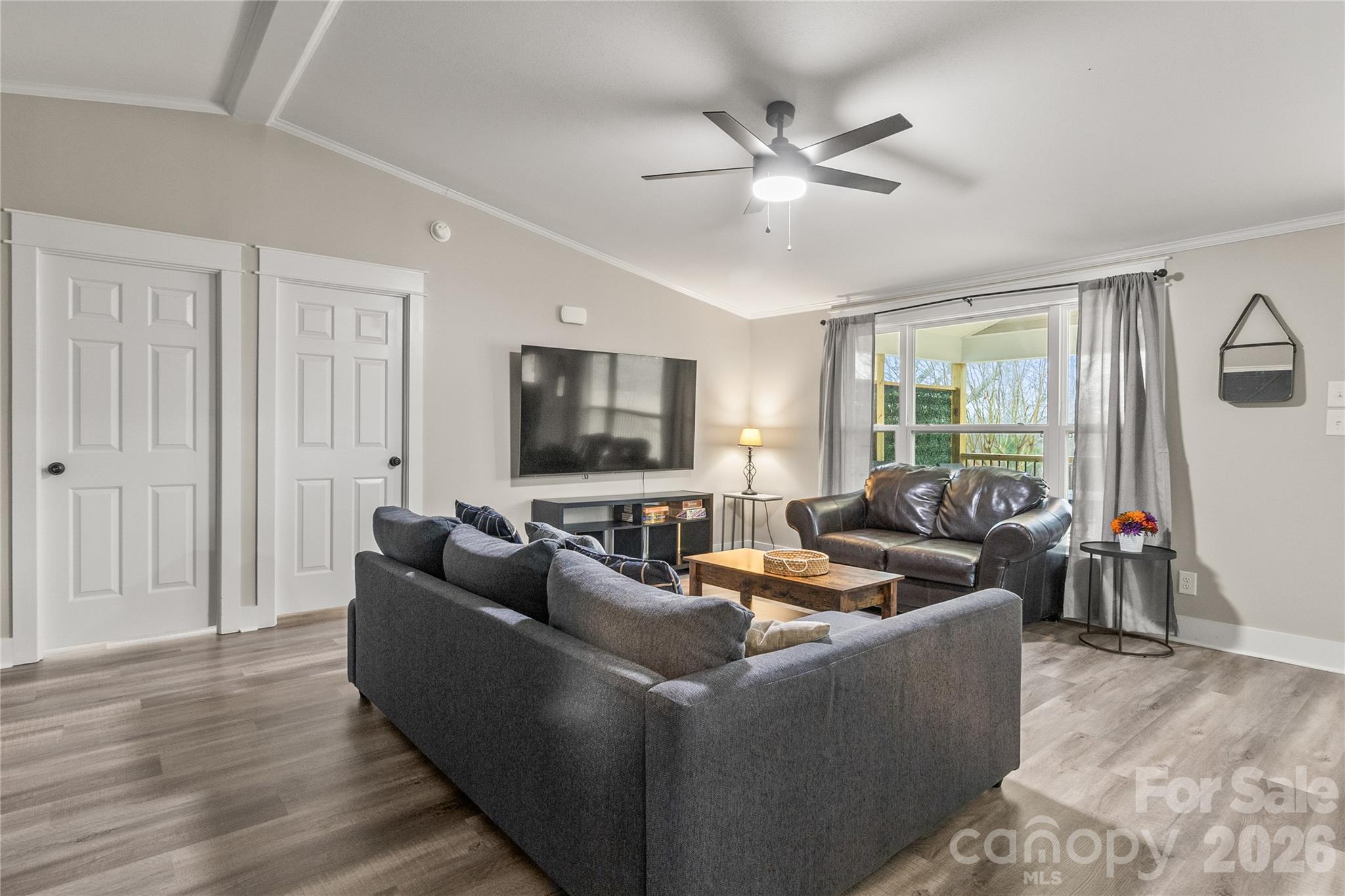 176 Odell School Road Concord, NC 28027 - Photo 24 of 46 a living room with furniture and a flat screen tv