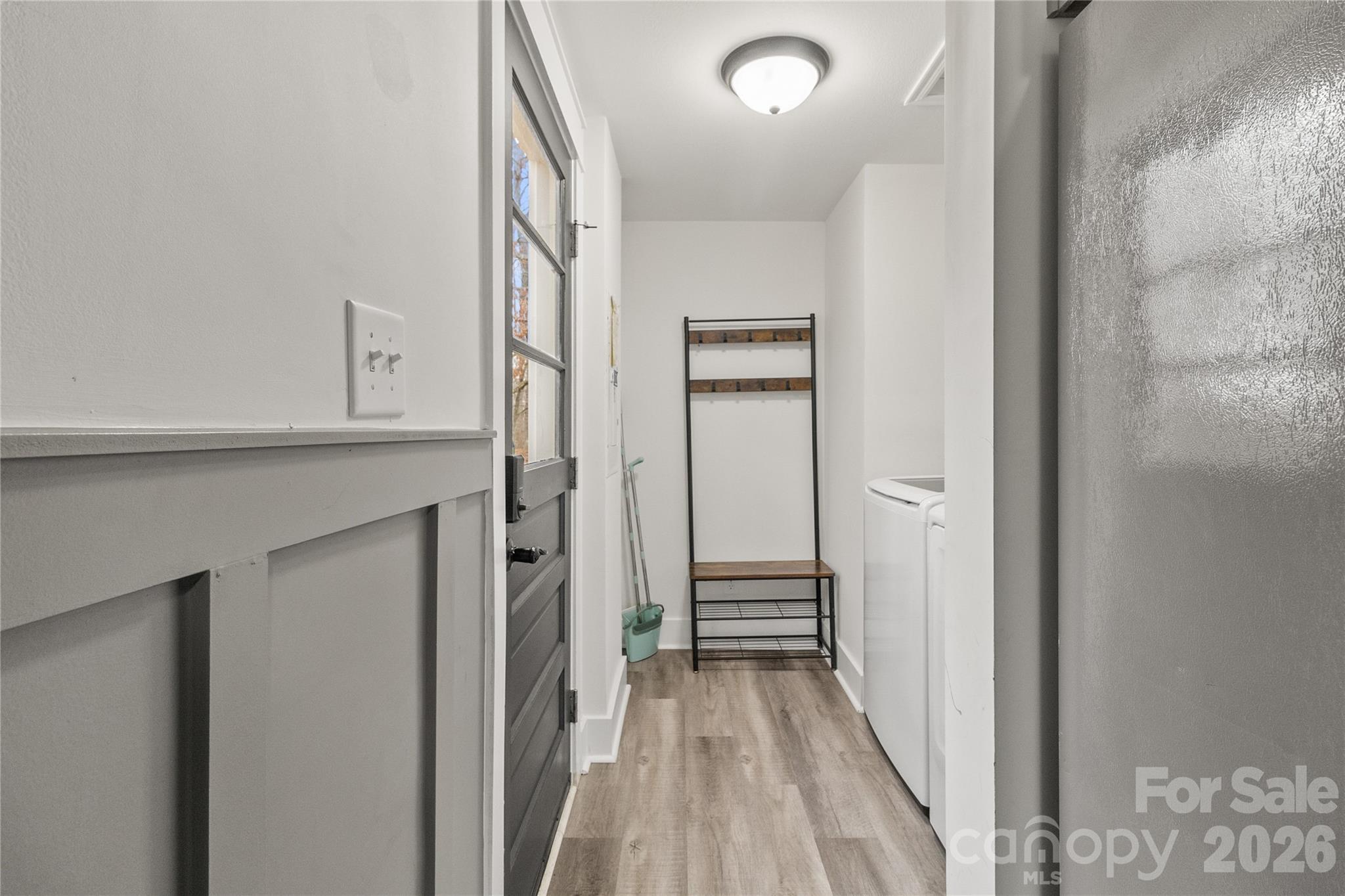 176 Odell School Road Concord, NC 28027 - Photo 25 of 46 a view of a hallway with wooden floor and entryway