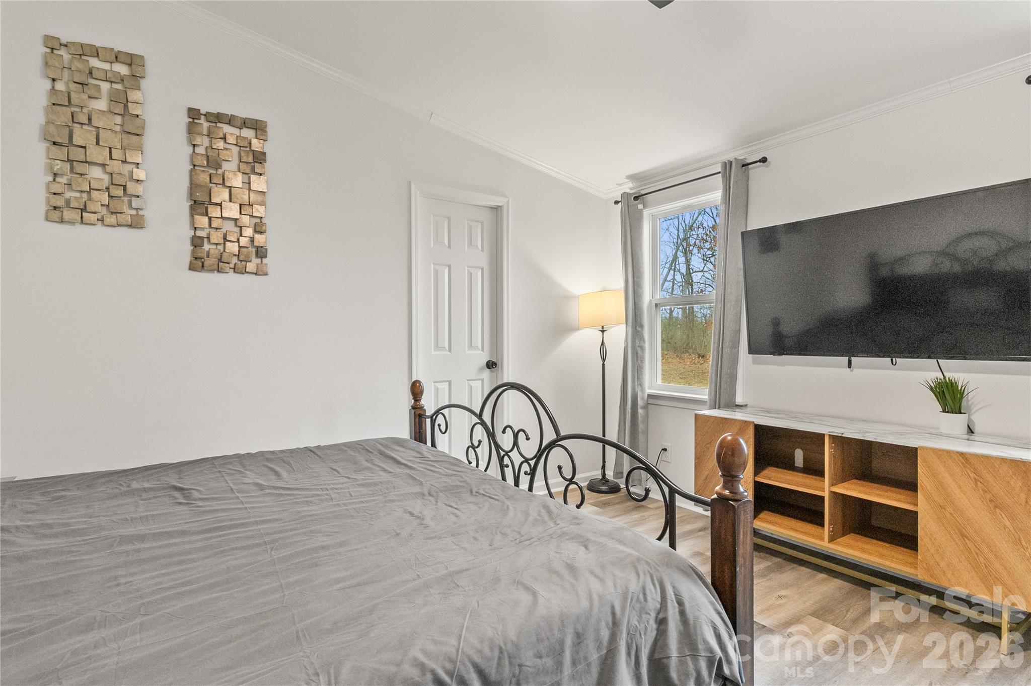 176 Odell School Road Concord, NC 28027 - Photo 29 of 46 a bedroom with a bed and a flat screen tv