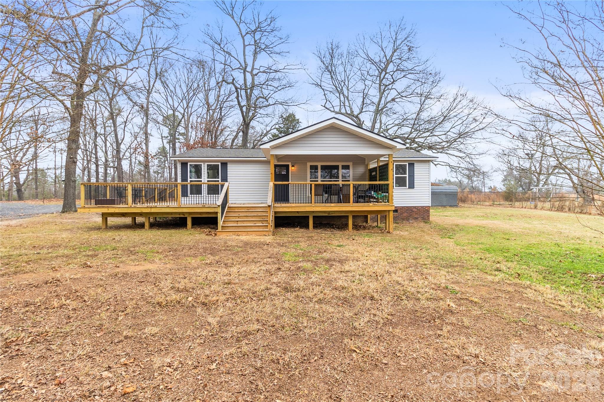 176 Odell School Road Concord, NC 28027 - Photo 3 of 46 a front view of a house with a yard