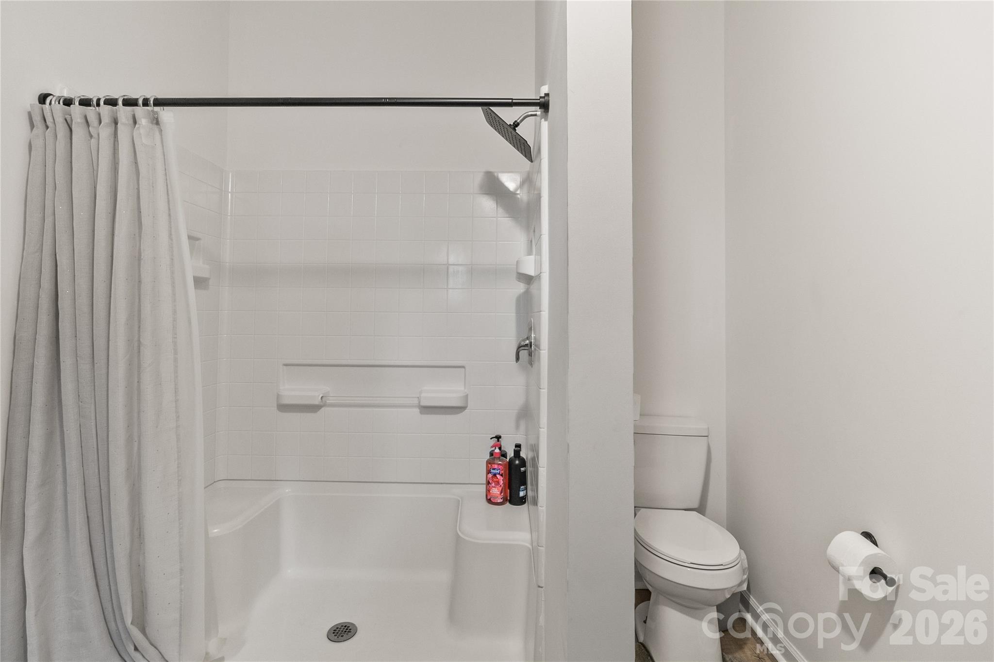 176 Odell School Road Concord, NC 28027 - Photo 31 of 46 a bathroom with a shower and a toilet