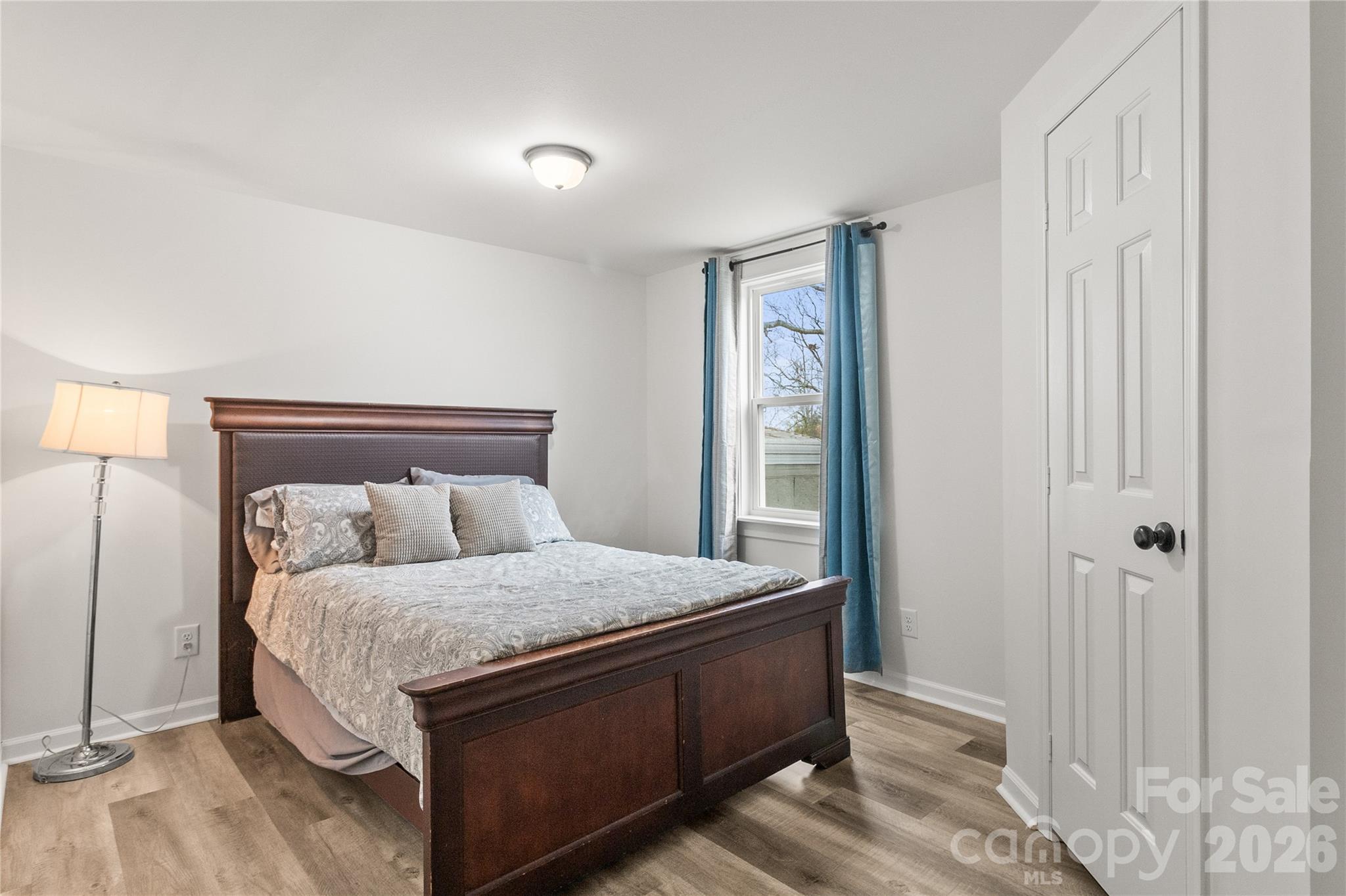 176 Odell School Road Concord, NC 28027 - Photo 33 of 46 a bedroom with a bed and a mirror