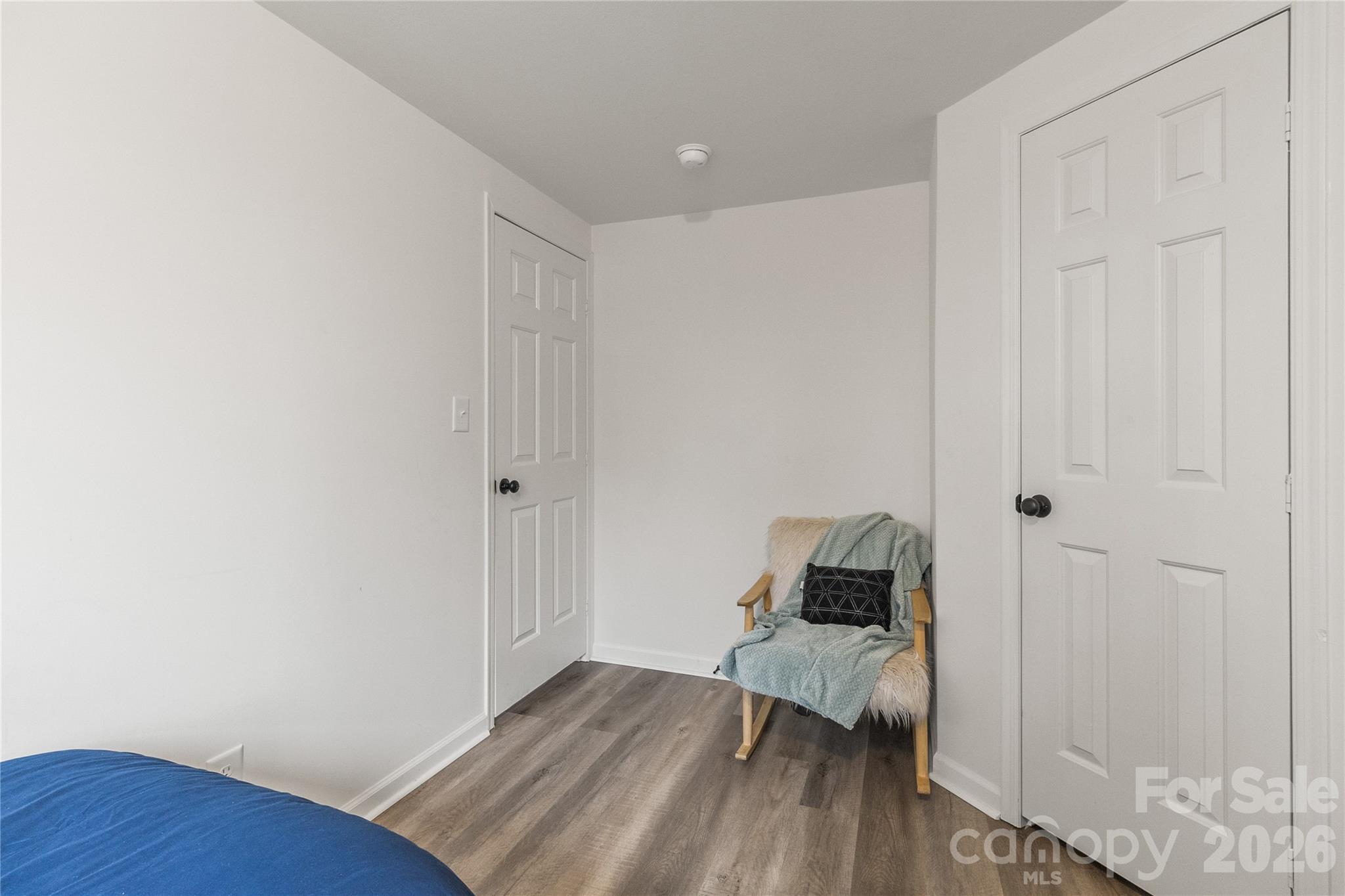 176 Odell School Road Concord, NC 28027 - Photo 37 of 46 a bedroom with a bed and wooden floor