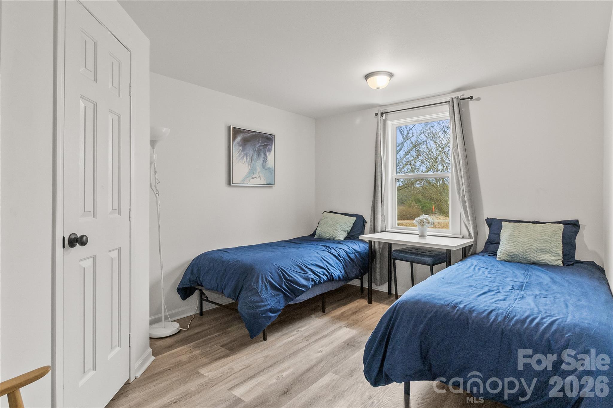 176 Odell School Road Concord, NC 28027 - Photo 38 of 46 a bedroom with two beds and a window