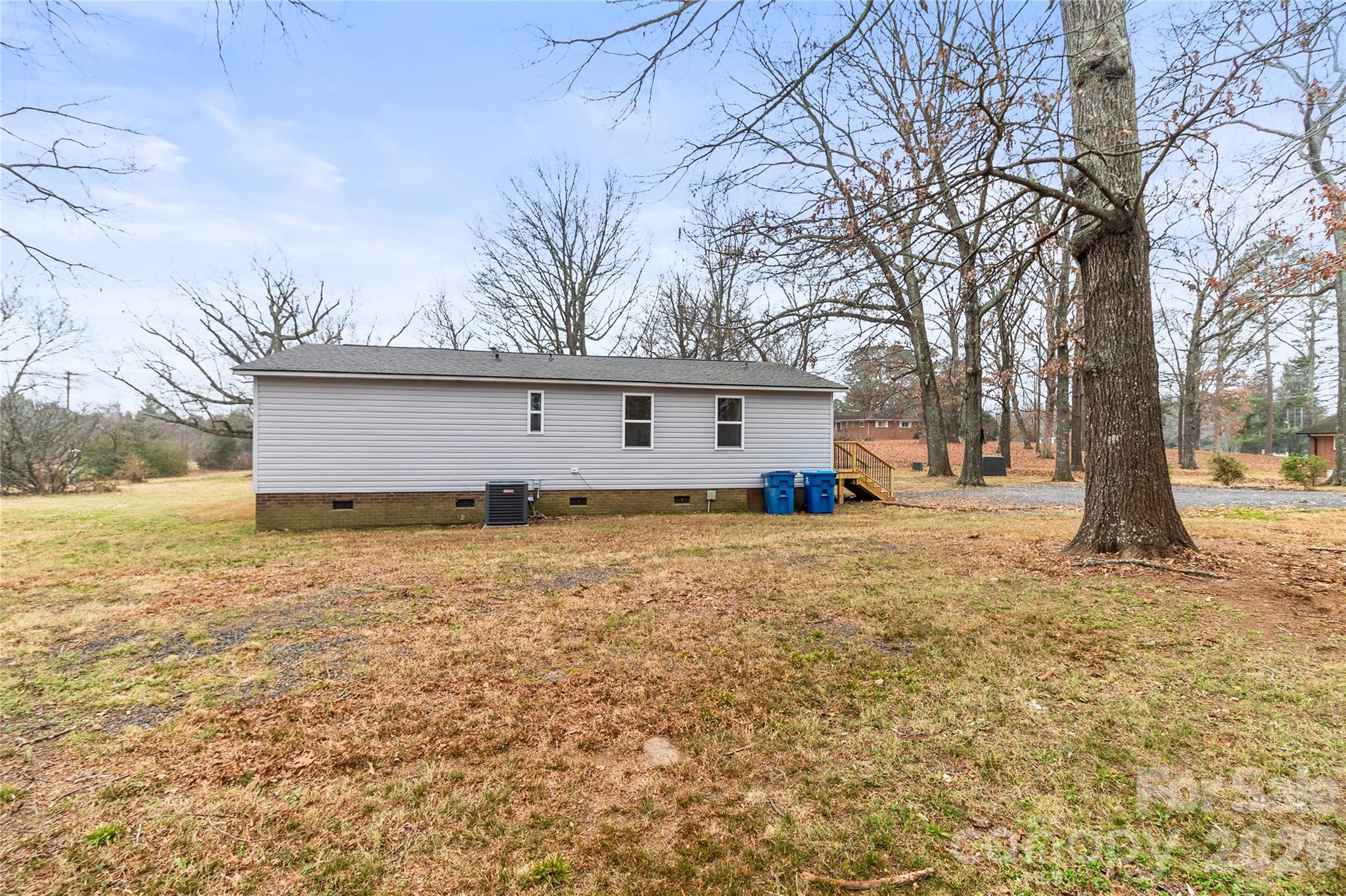 176 Odell School Road Concord, NC 28027 - Photo 39 of 46 a front view of house with yard and trees