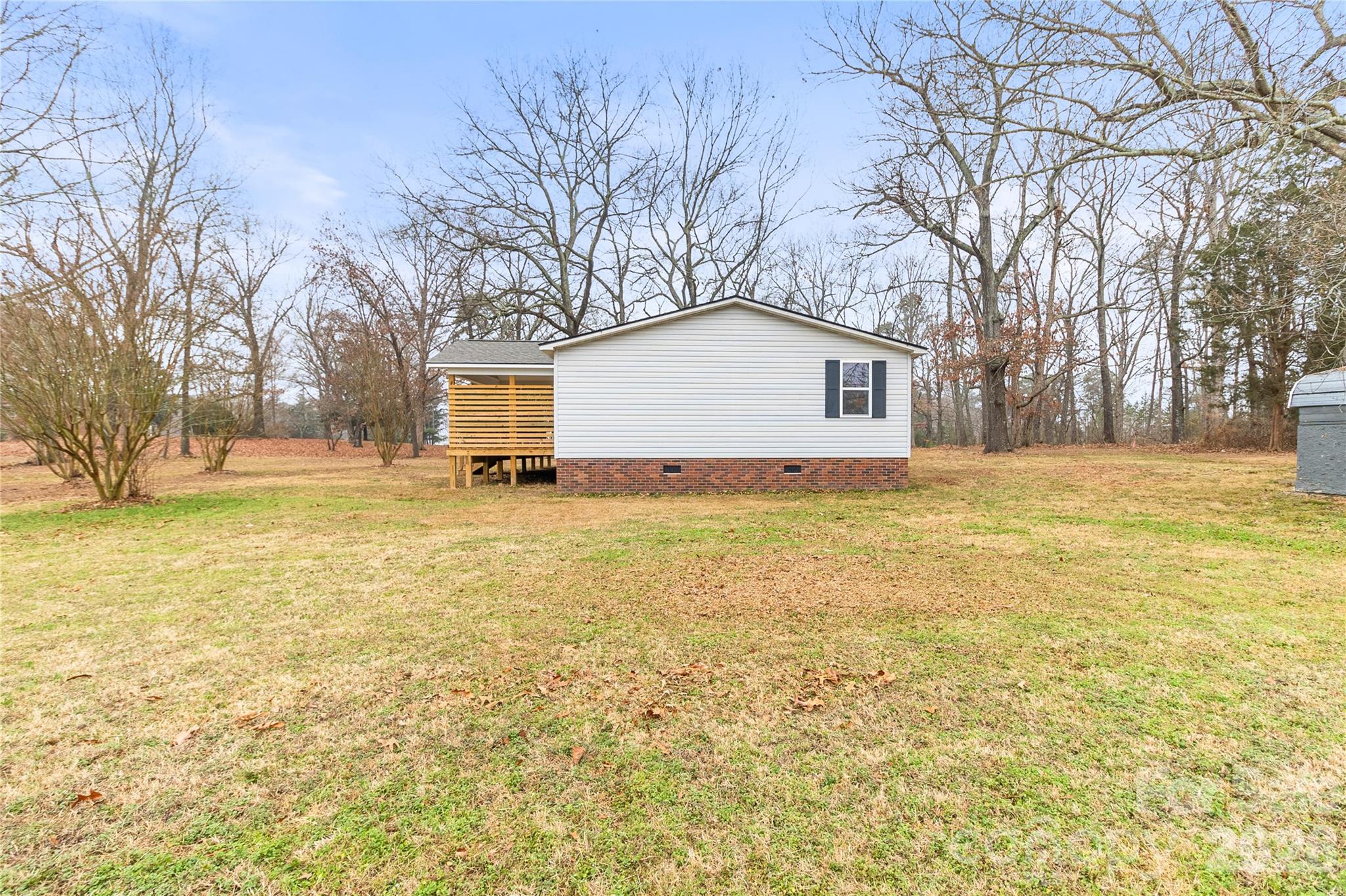 176 Odell School Road Concord, NC 28027 - Photo 40 of 46 a white house that has a tree in front of it