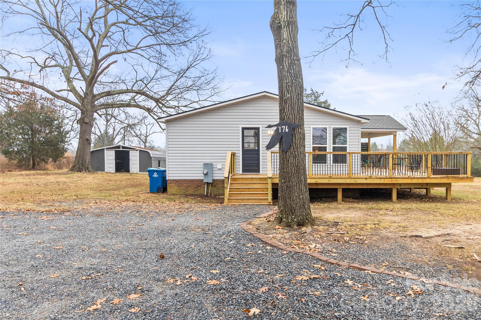 176 Odell School Road Concord, NC 28027 - Photo 4 of 46 a view of a house with a yard and sitting area