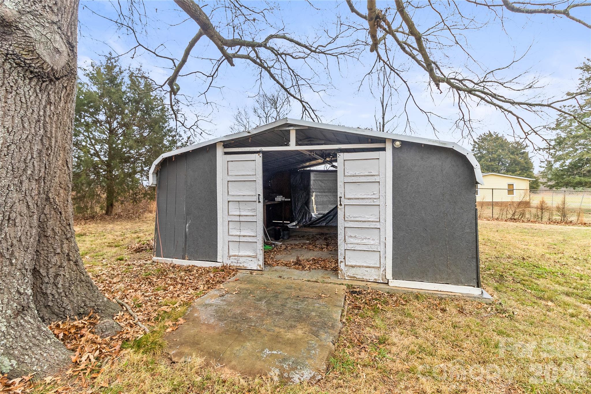 176 Odell School Road Concord, NC 28027 - Photo 42 of 46 a view of a house with a snow in the yard