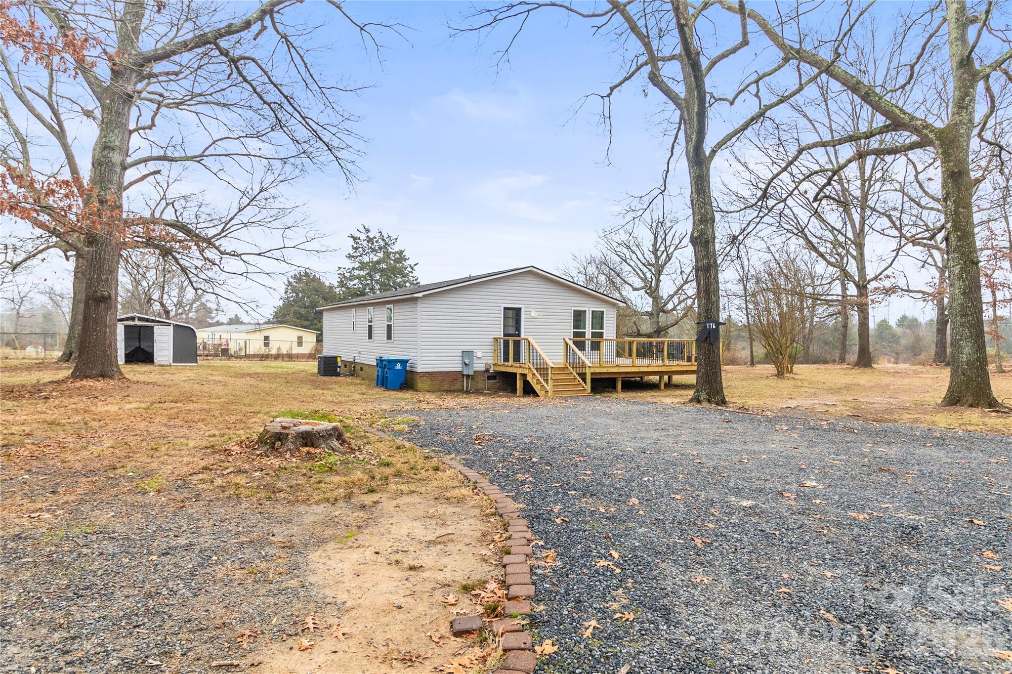 176 Odell School Road Concord, NC 28027 - Photo 43 of 46 a front view of a house with a yard covered in snow