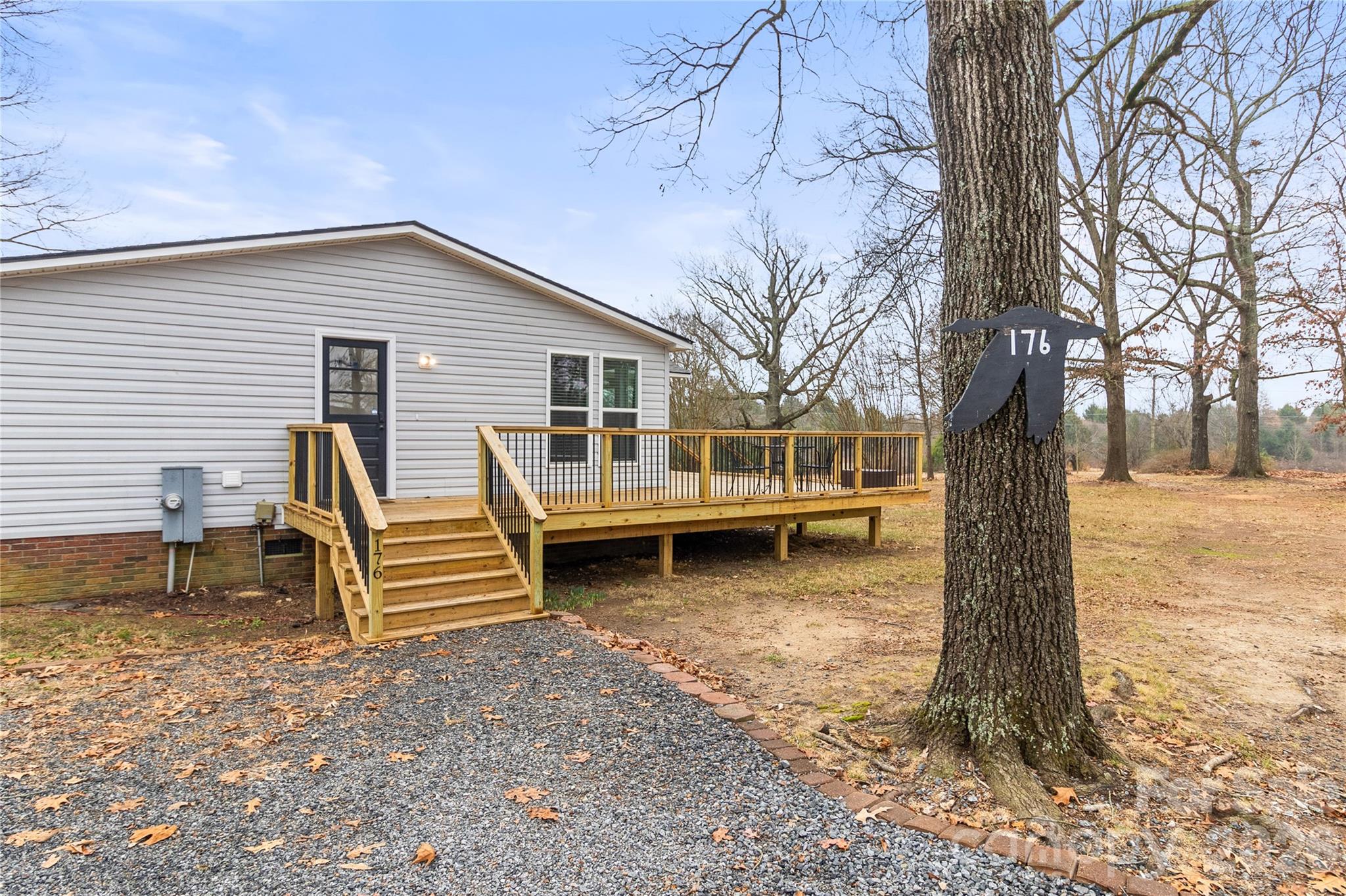 176 Odell School Road Concord, NC 28027 - Photo 44 of 46 a view of a house with backyard and trees