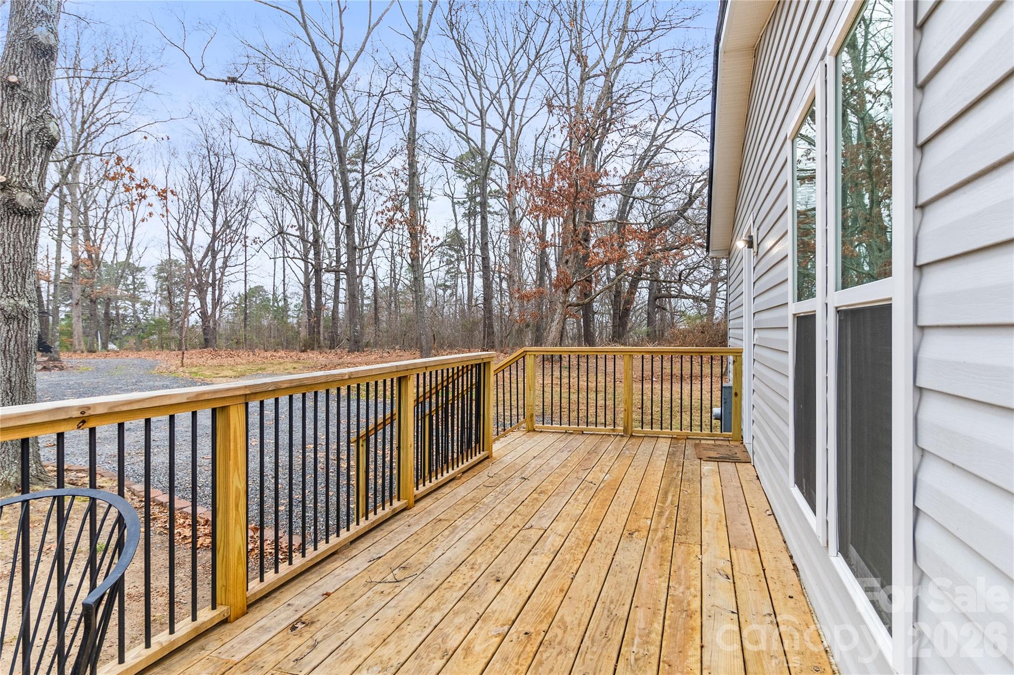 176 Odell School Road Concord, NC 28027 - Photo 10 of 46 a view of a wooden deck with a trees