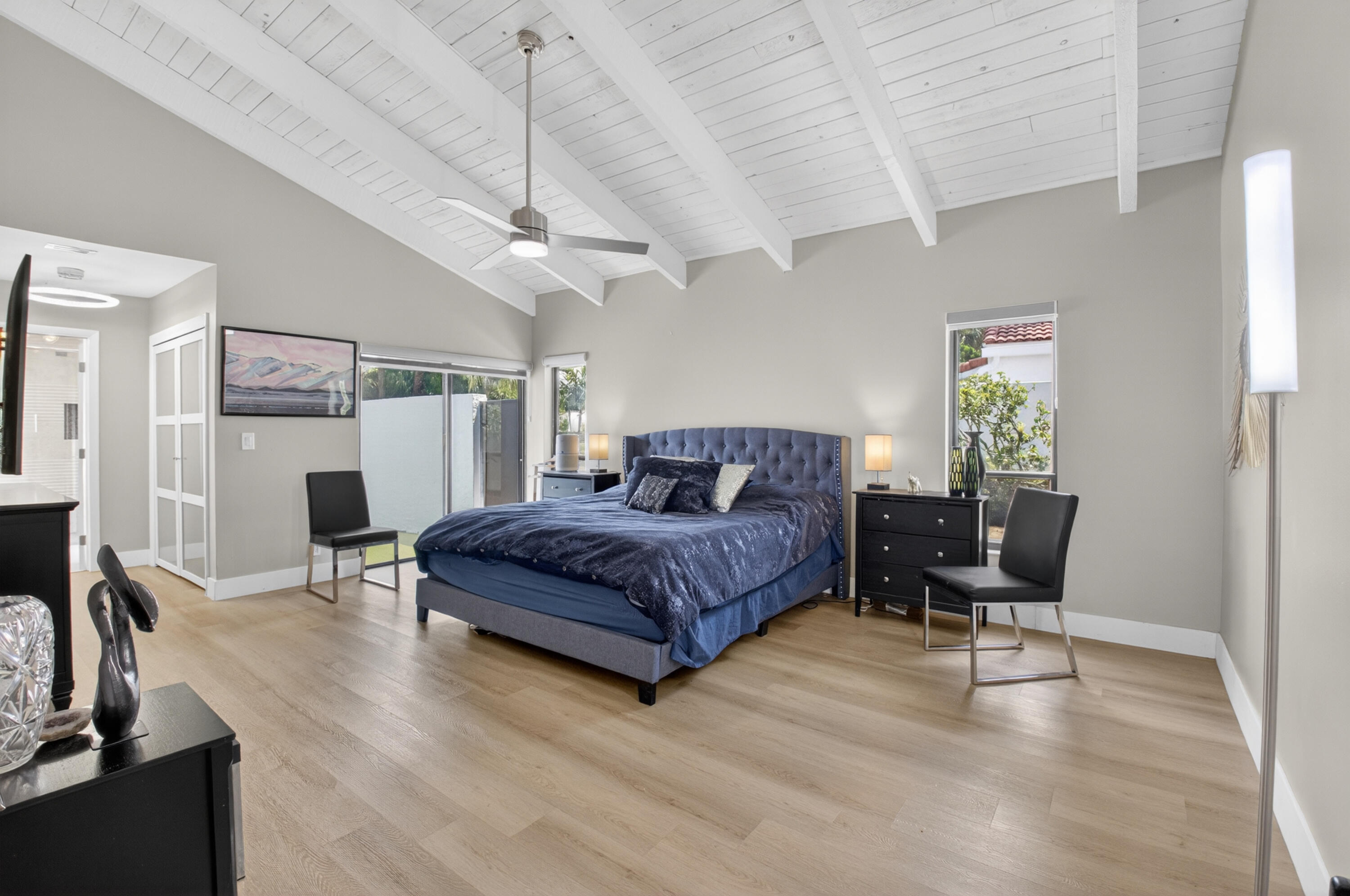 7374 Woodmont Court Boca Raton, FL 33434 - Photo 24 of 95 a spacious bedroom with a bed a table and chair