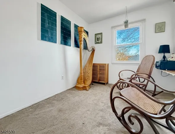 a view of a livingroom with furniture and windows