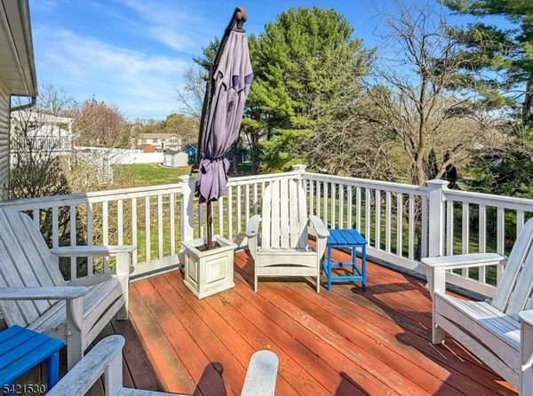 a view of a balcony with chairs