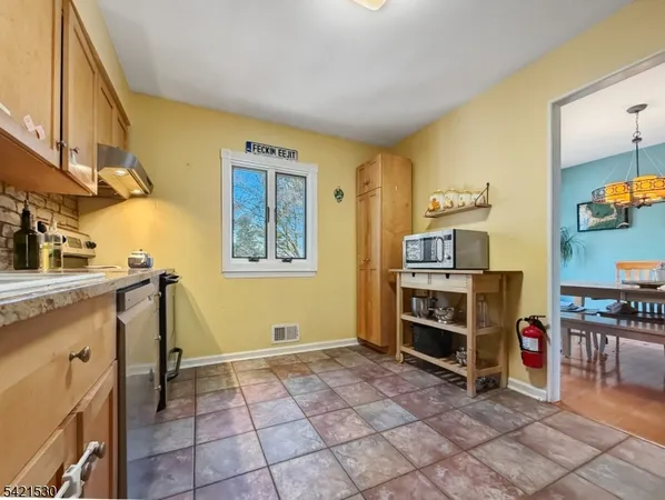 a kitchen with stainless steel appliances cabinets and a counter top space