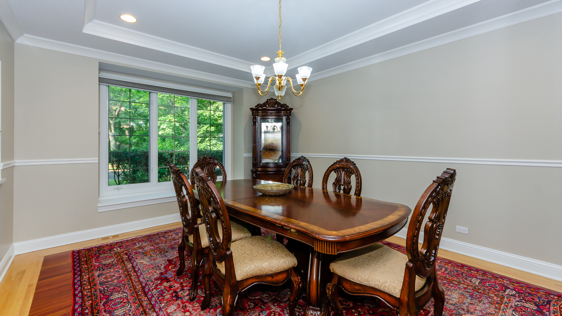 230 Devon Drive Burr Ridge, IL 60527 - Photo 14 of 94 a dining room with furniture a chandelier and window