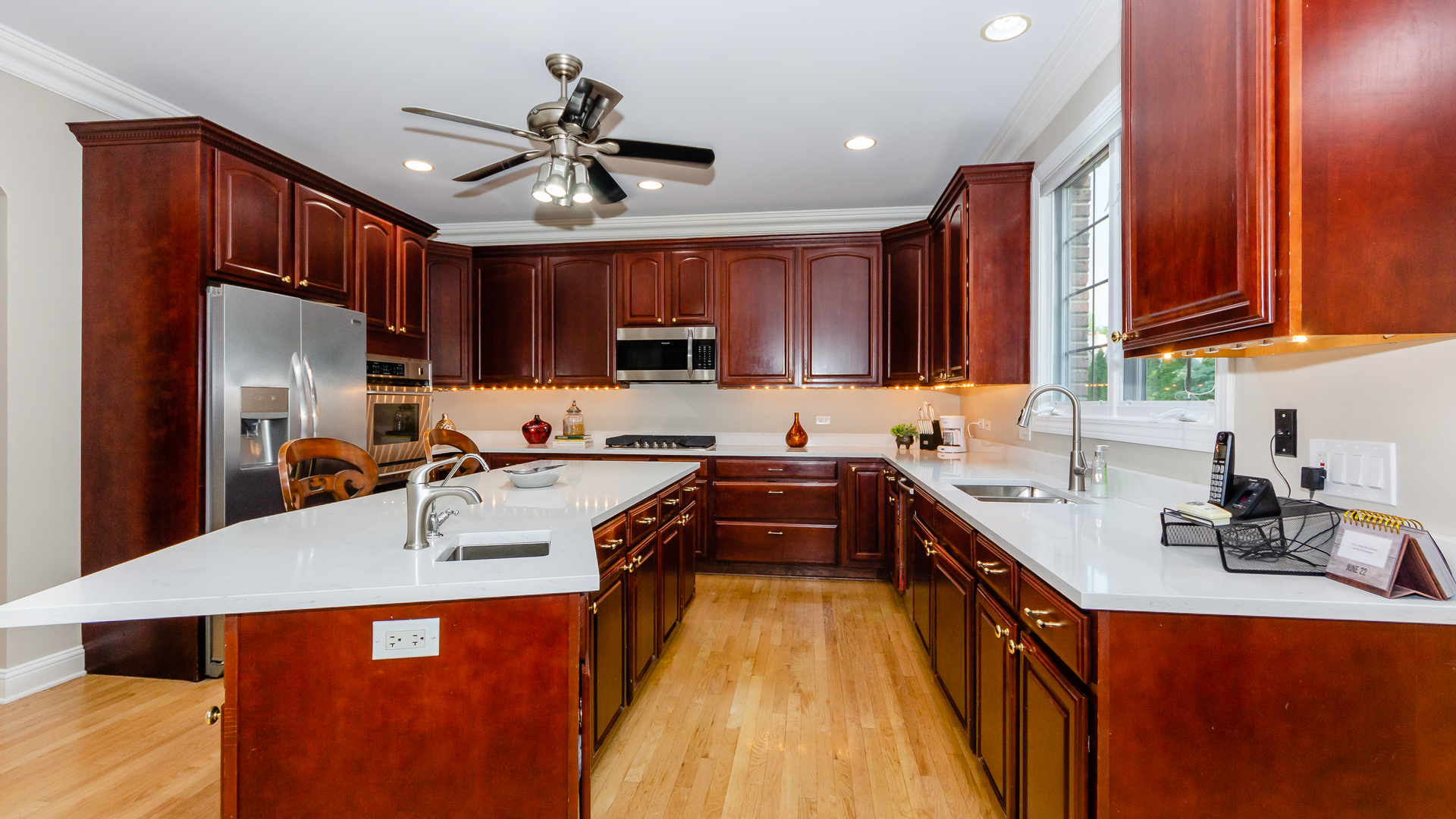 230 Devon Drive Burr Ridge, IL 60527 - Photo 17 of 94 a kitchen with stainless steel appliances granite countertop a sink stove and refrigerator