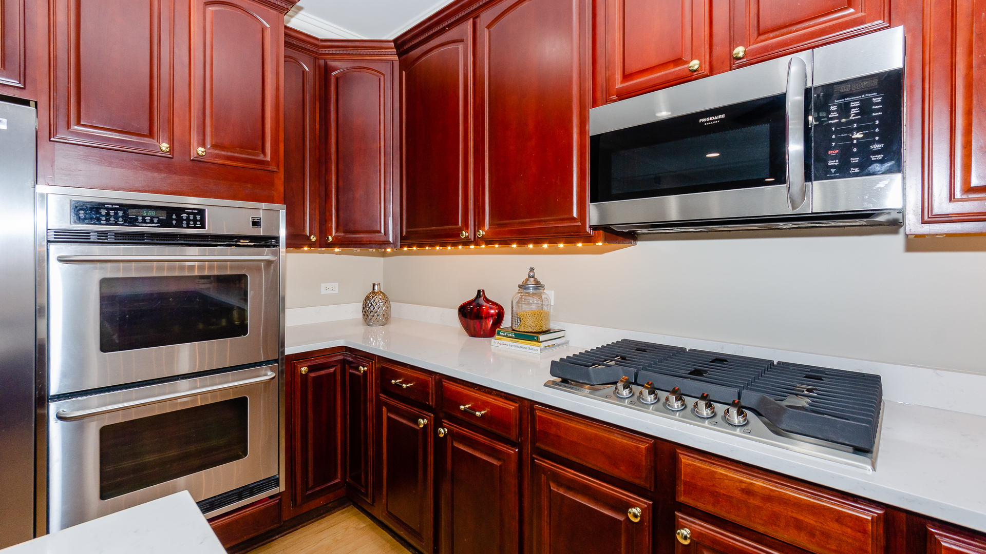 230 Devon Drive Burr Ridge, IL 60527 - Photo 21 of 94 a kitchen with stainless steel appliances granite countertop a stove microwave and cabinets
