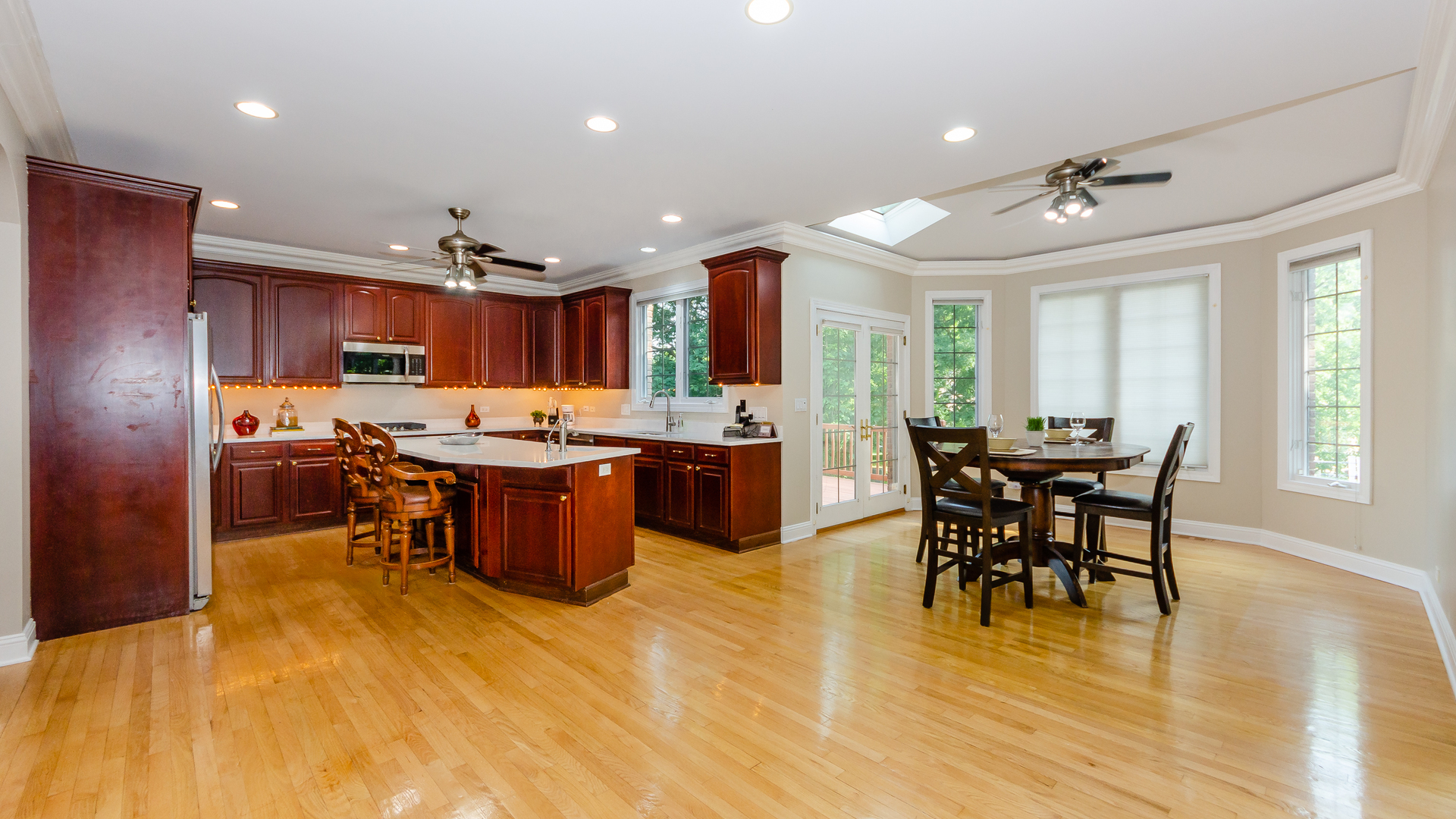 230 Devon Drive Burr Ridge, IL 60527 - Photo 23 of 94 a kitchen with a table and chairs in it