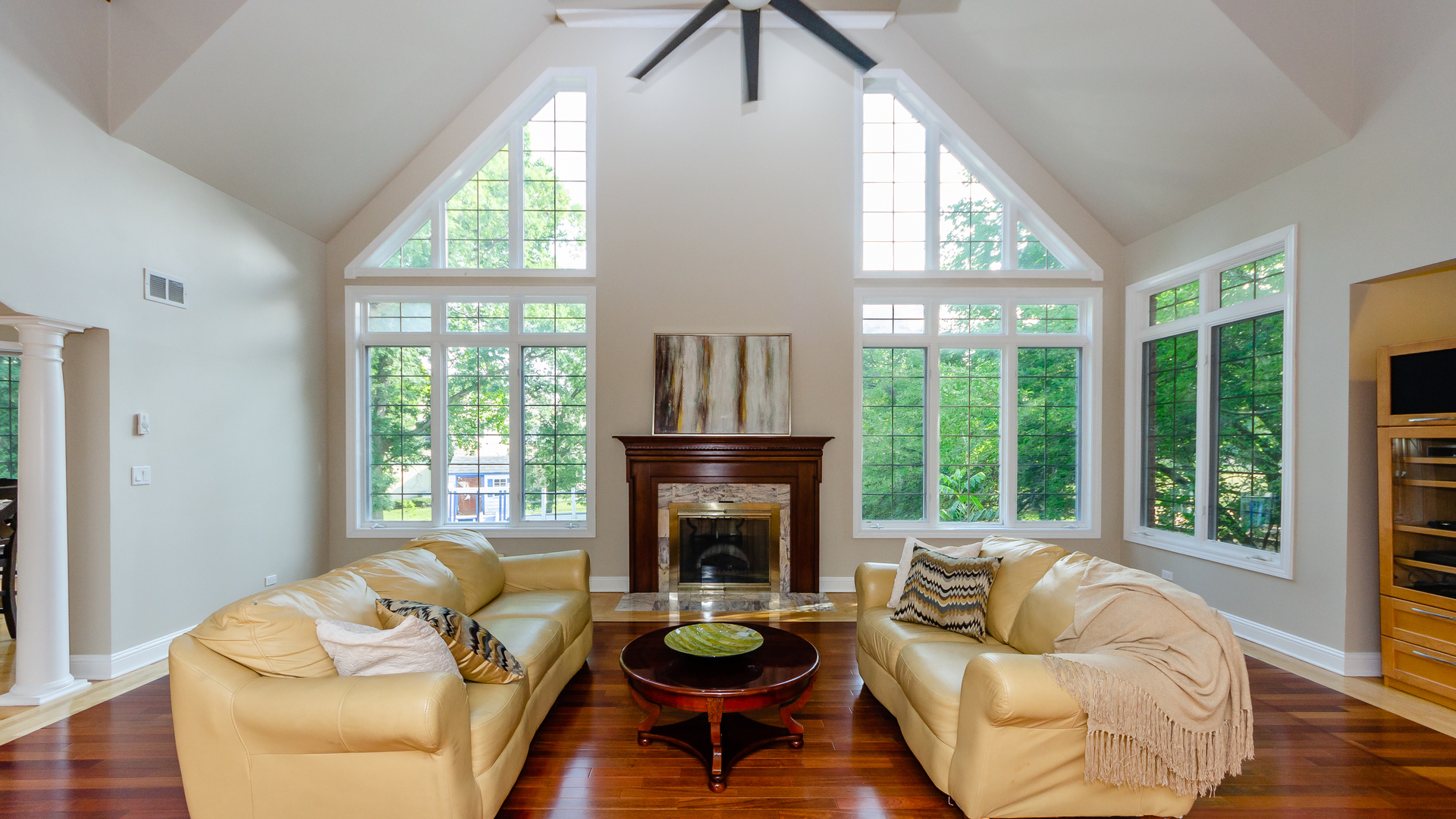 230 Devon Drive Burr Ridge, IL 60527 - Photo 30 of 94 a living room with furniture a large window and a fireplace