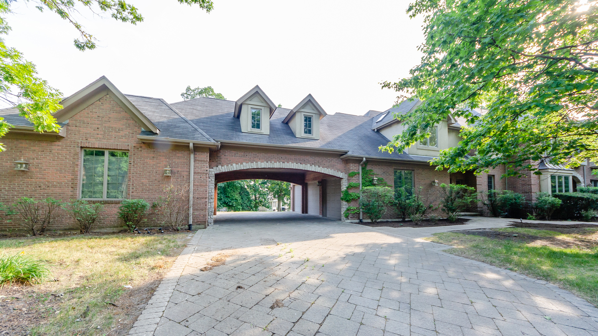 230 Devon Drive Burr Ridge, IL 60527 - Photo 4 of 94 a front view of a house with garden
