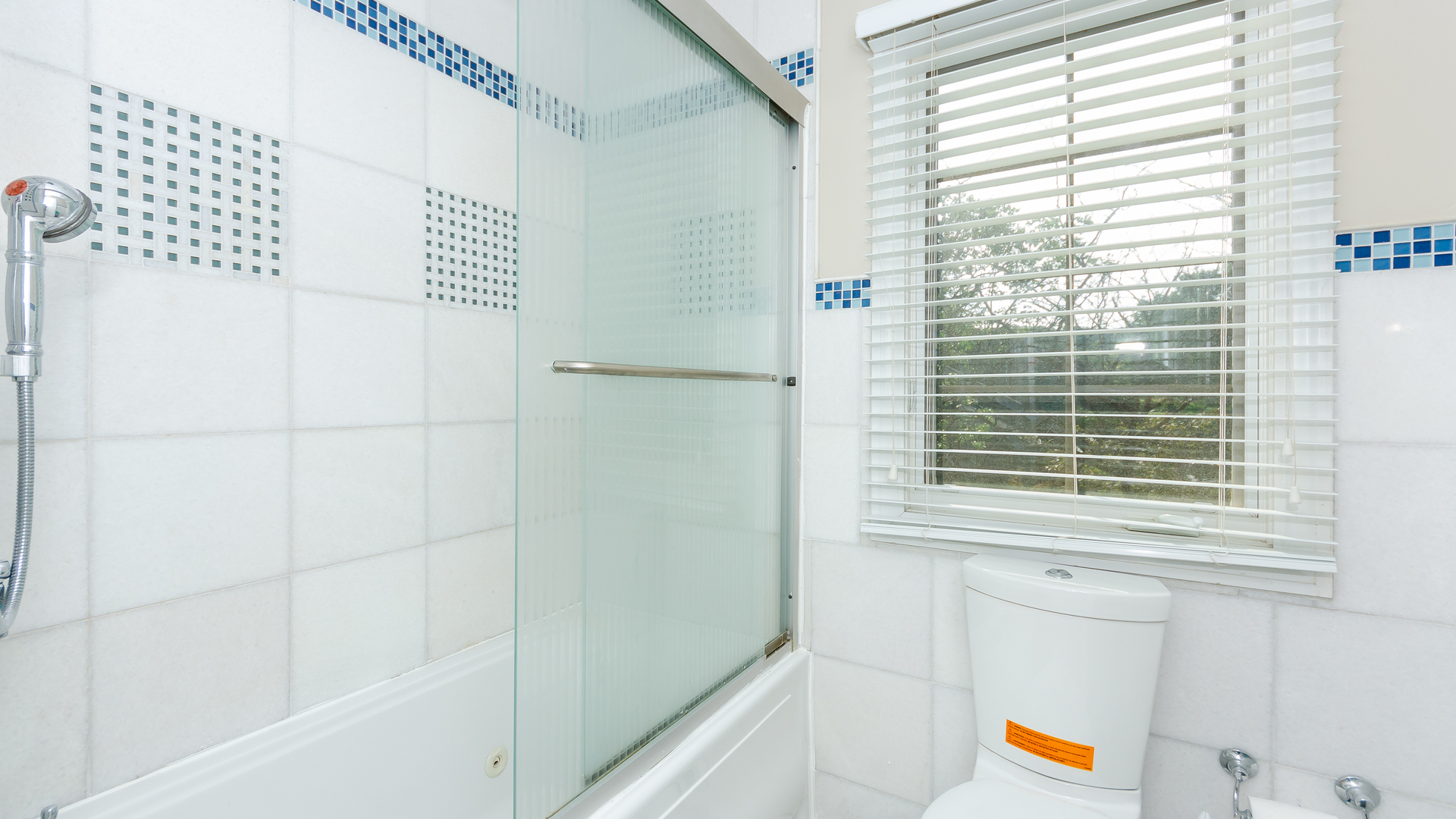 230 Devon Drive Burr Ridge, IL 60527 - Photo 54 of 94 a bathroom with a window and a shower