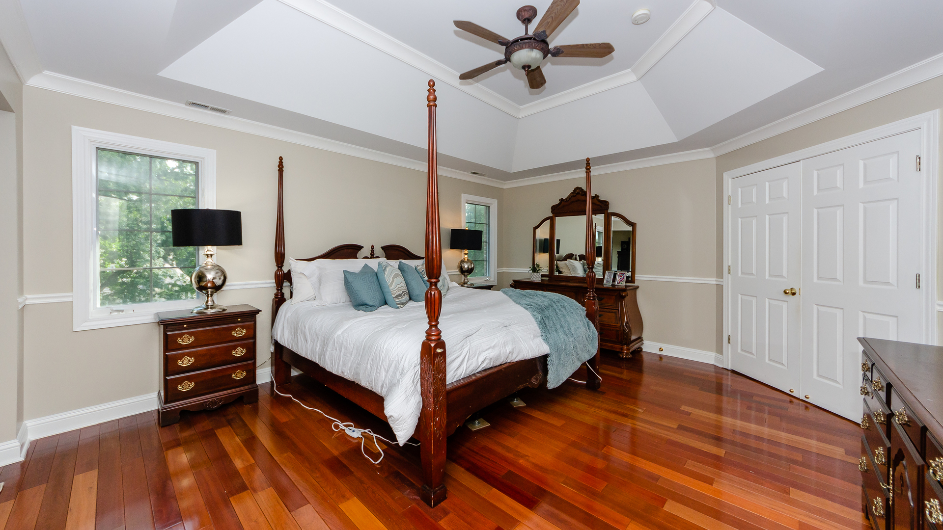 230 Devon Drive Burr Ridge, IL 60527 - Photo 56 of 94 a bed room with a bed and a chandelier