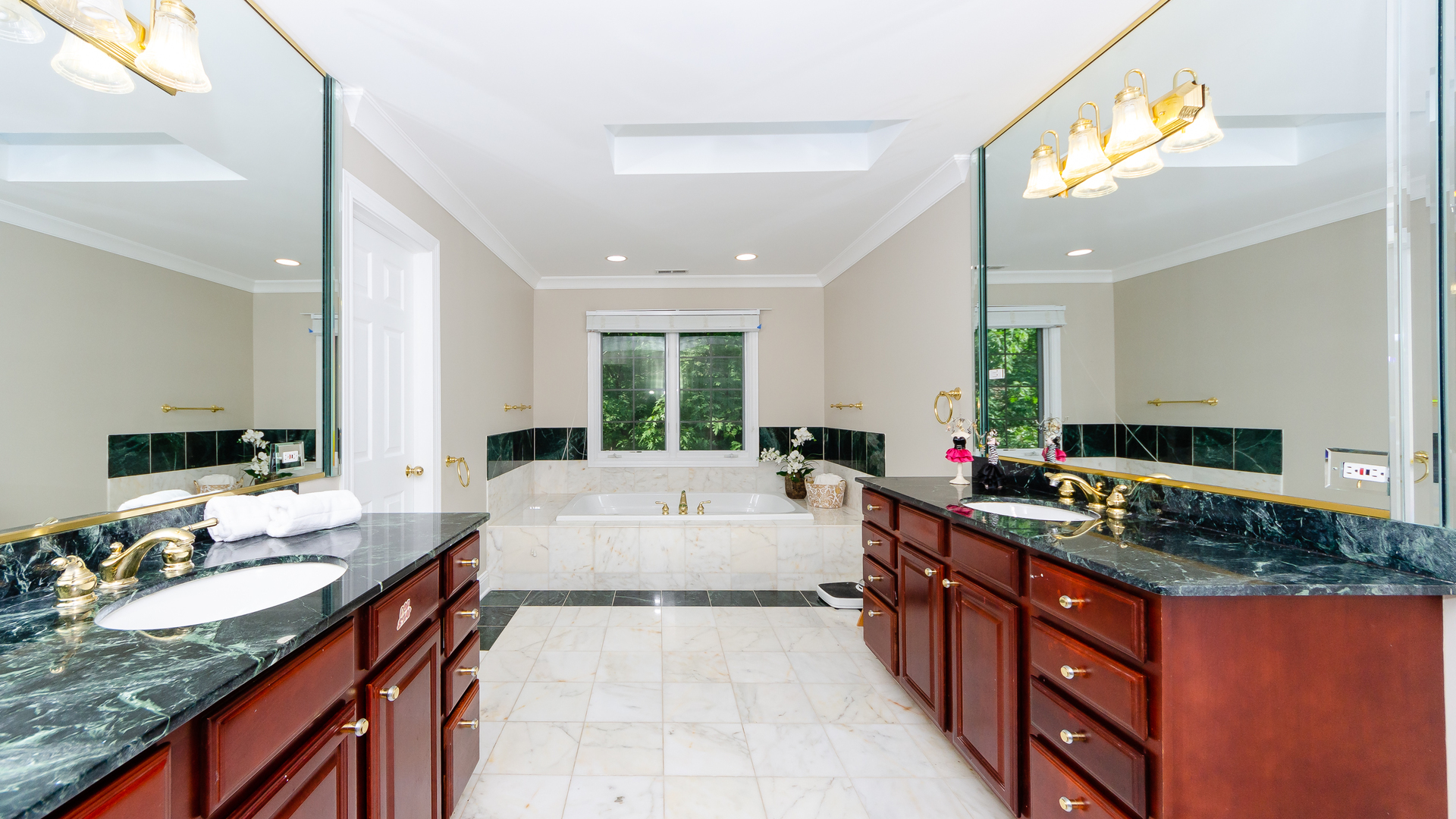 230 Devon Drive Burr Ridge, IL 60527 - Photo 59 of 94 a large kitchen with stainless steel appliances kitchen island granite countertop a lot of counter space and a sink