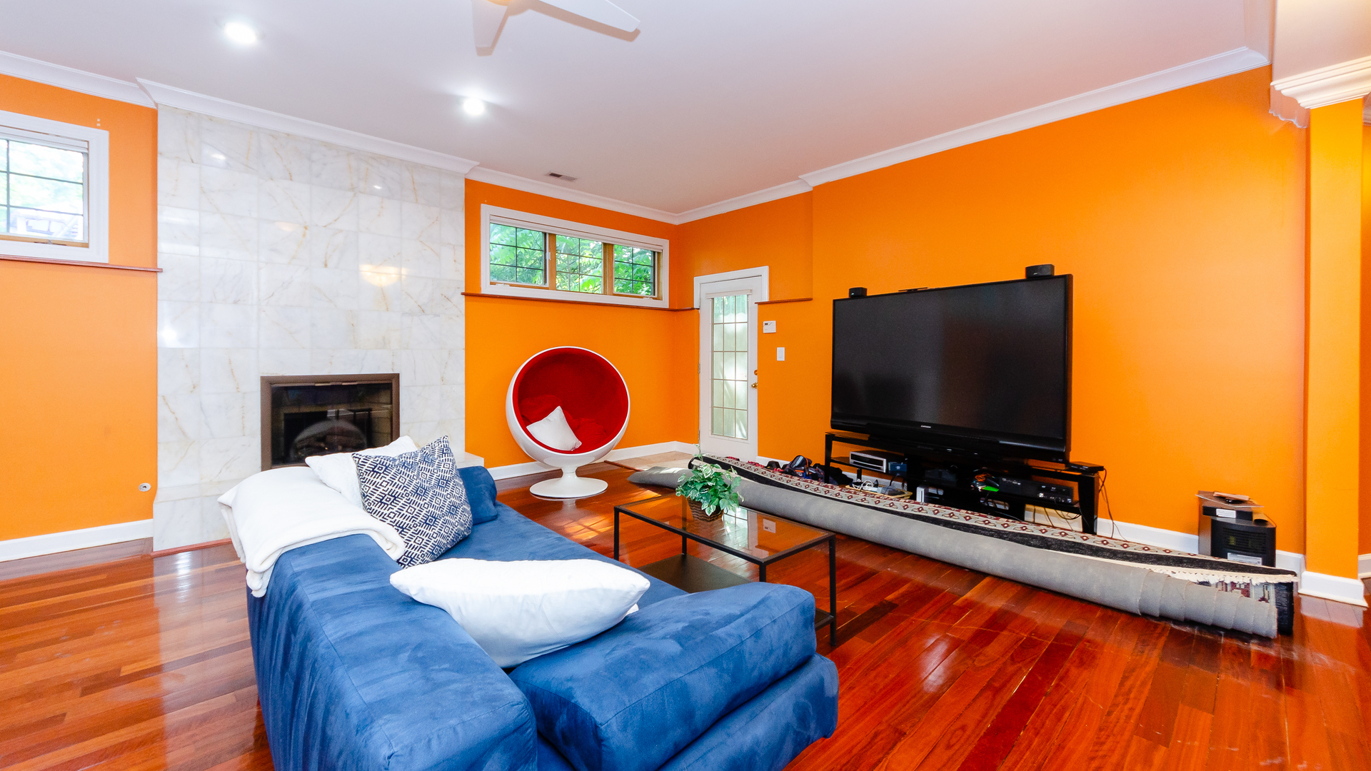 230 Devon Drive Burr Ridge, IL 60527 - Photo 67 of 94 a living room with furniture and a flat screen tv