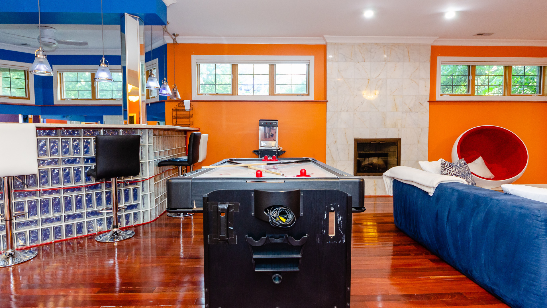 230 Devon Drive Burr Ridge, IL 60527 - Photo 70 of 94 a living room with furniture a fireplace and a flat screen tv