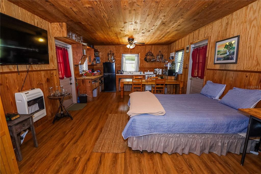 3850 Southeast 22 Court Bronson, FL 32621 - Photo 20 of 40 a living room with furniture and a flat screen tv