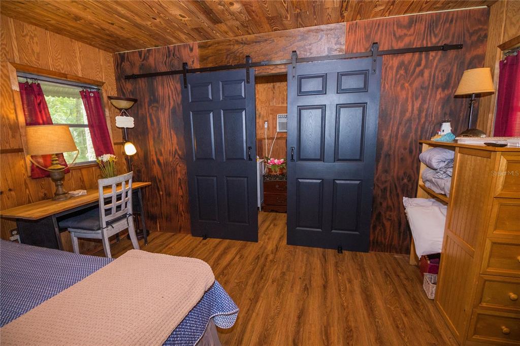 3850 Southeast 22 Court Bronson, FL 32621 - Photo 23 of 40 a bed room with a bed and furniture