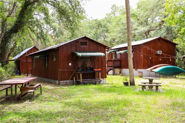 a backyard of a house with barbeque oven