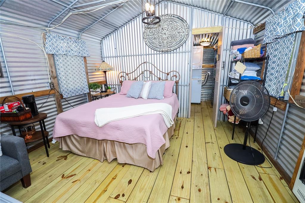 3850 Southeast 22 Court Bronson, FL 32621 - Photo 33 of 40 a bed room with a bed and a table