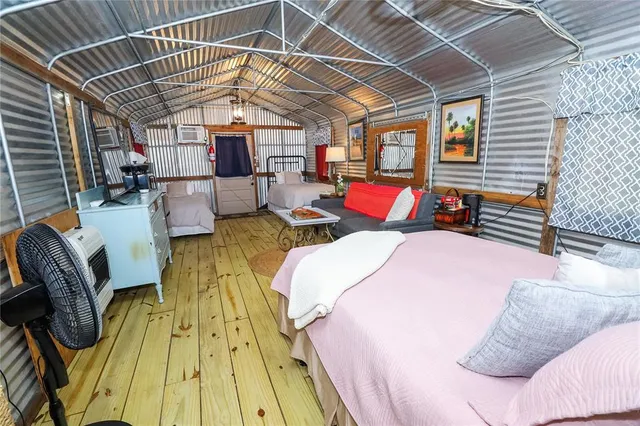 a bathroom with a toilet and a shower curtain