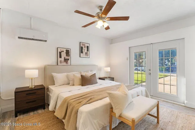 a living room with furniture fireplace and wooden floor