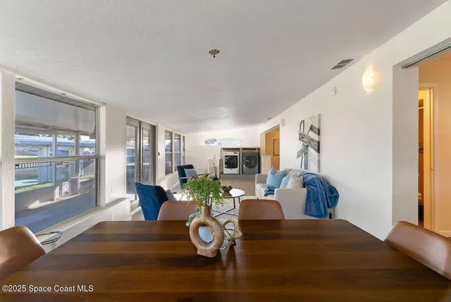 a bathroom with a granite countertop sink toilet and mirror