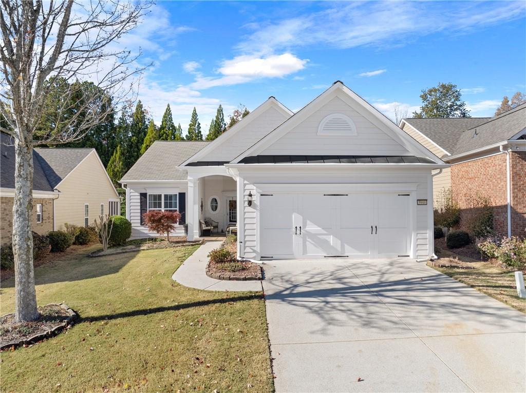 5944 Bellflower Way Hoschton, GA 30548 - Photo 1 of 1 a view of a white house with a large tree