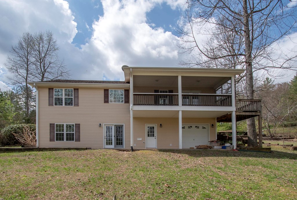 5224 Laurel Ridge Young Harris, GA 30582 - Photo 23 of 39 a view of a house with a yard and a large tree