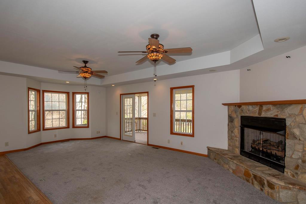 5224 Laurel Ridge Young Harris, GA 30582 - Photo 4 of 39 a view of a livingroom with a fireplace and windows