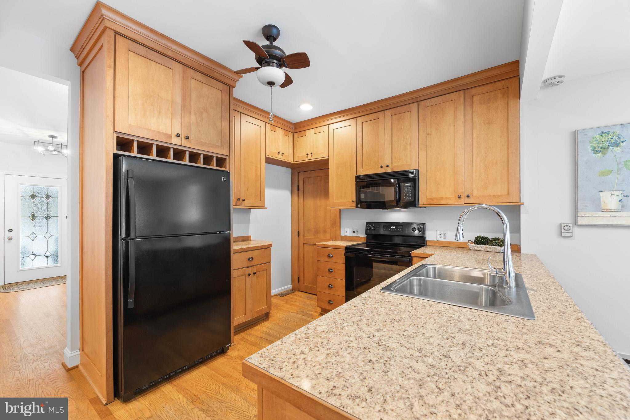 1709 Governor Bridge Road Davidsonville, MD 21035 - Photo 6 of 25 Kitchen with ample wooden cabinetry, pantry closet