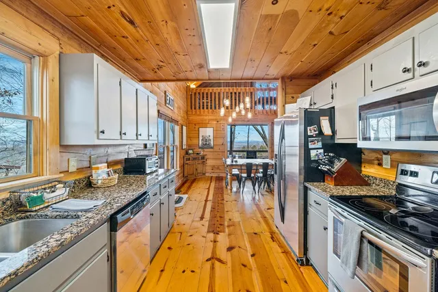 a kitchen with granite countertop lots of counter top space